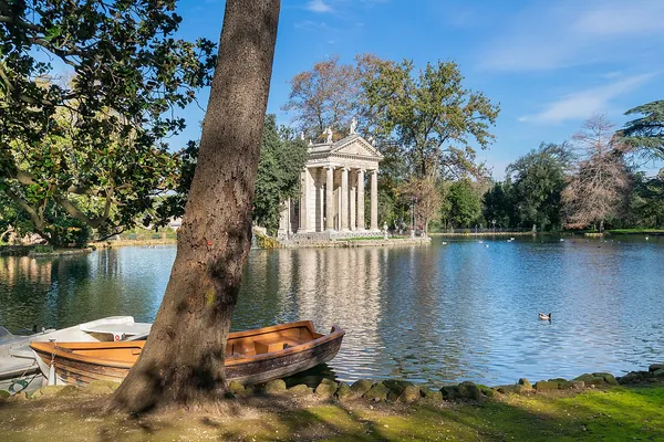 The lake at Villa Borghese with the Temple of Asclepius and rowing boats